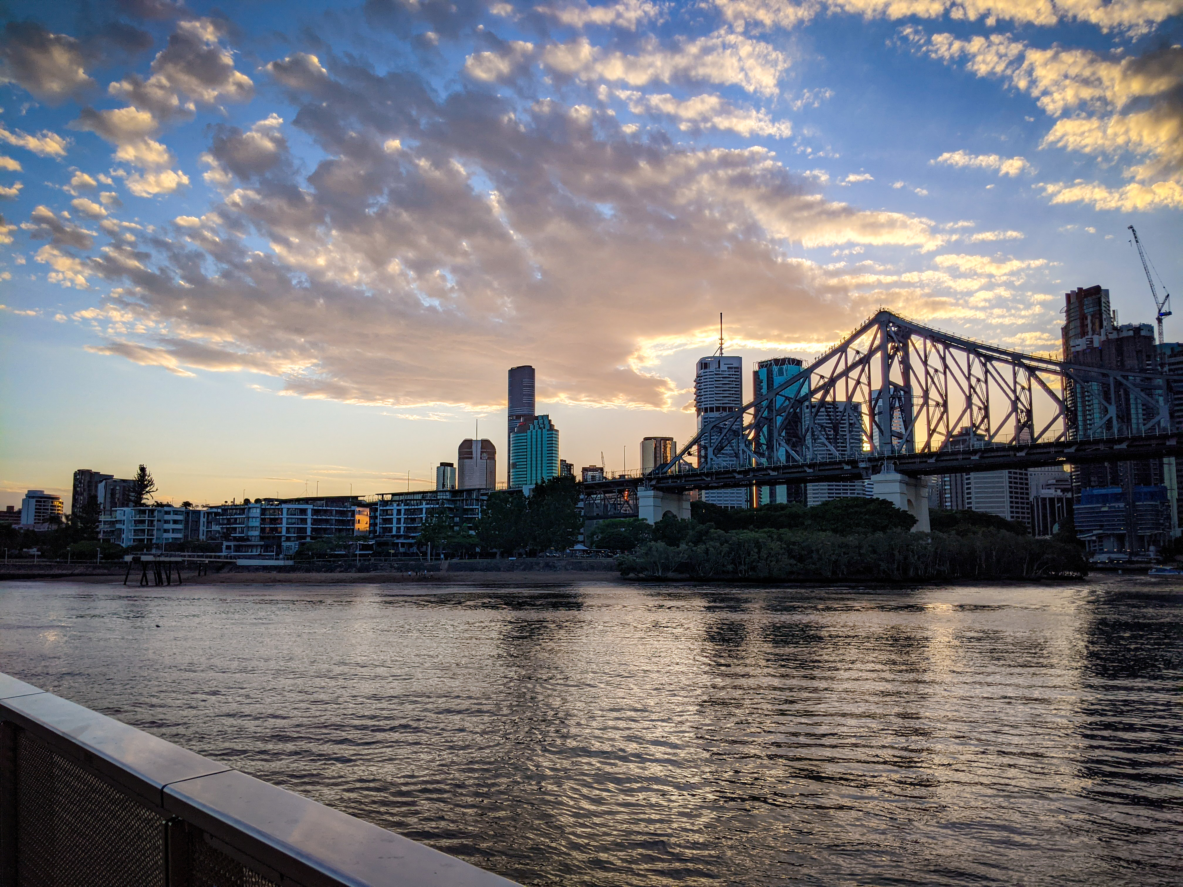 The south support of the Storey Bridge with sunset behind the Brisbane CBD